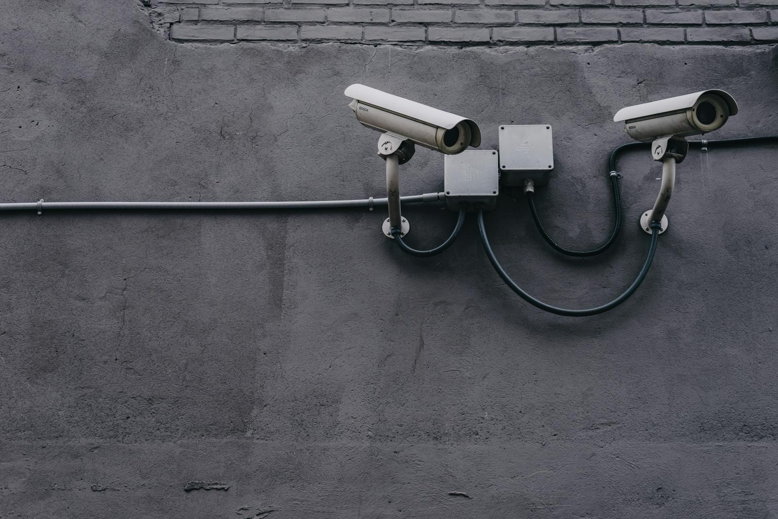 Exterior bullet cameras mounted on a commercial building